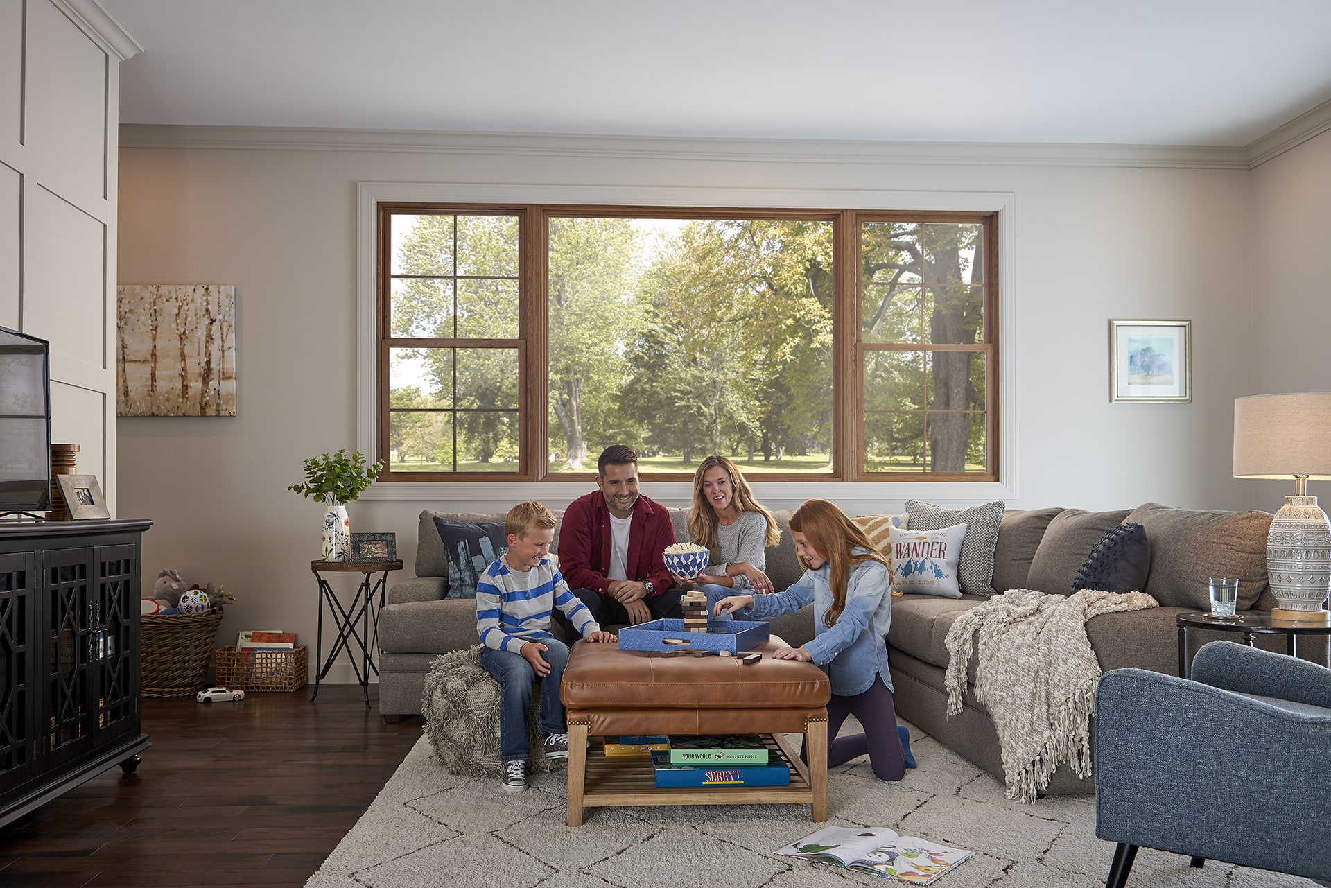 Family playing a game together by the couch